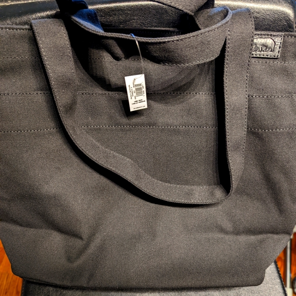 Canvas tote with zippered top.